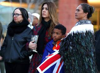 Aramoama Elmore, 8, is wrapped in a New Zealand flag during a vigil at UNLV Friday, March 15, 2019. Also pictured from left: Rev. Rachel Baker, Mercedes Krause, and Rata Elmore. The vigil honored lives lost due to hate and violence around the world and to honor the 49 lives lost in the New Zealand mosque attacks.