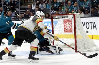 Vegas Golden Knights center Paul Stastny, center, shoots against San Jose Sharks defenseman Justin Braun (61) to score a goal during the second period of an NHL hockey game in San Jose, Calif., Monday, March 18, 2019.