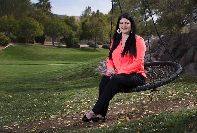Loni Gray, field marketing manager for Brown-Forman, poses in Harmony Park in Henderson Tuesday, March 19, 2019.