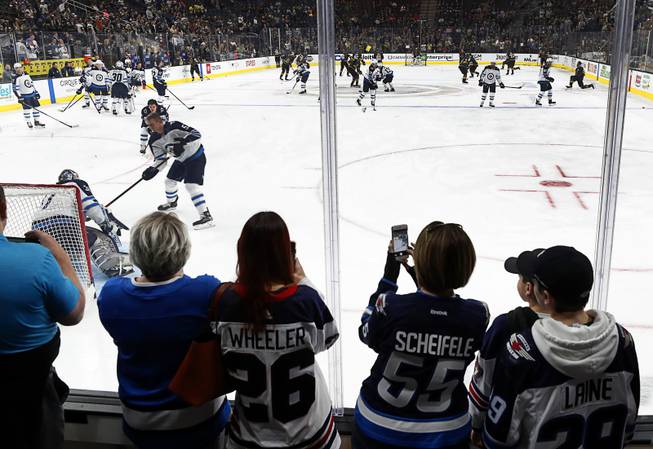 Winnipeg Jets fans watch warm-ups before a game against the Vegas Golden Knights at T-Mobile Arena Thursday, March 21, 2019.