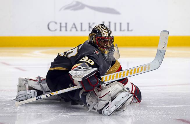 Vegas Golden Knights goaltender Malcolm Subban (30) stretches before the start of the second period against the Winnipeg Jets at T-Mobile Arena Thursday, March 21, 2019.