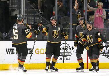 Golden Knights right wing Reilly Smith, second left, celebrates with teammates after scoring against Winnipeg, Thursday, March 21, 2019. 