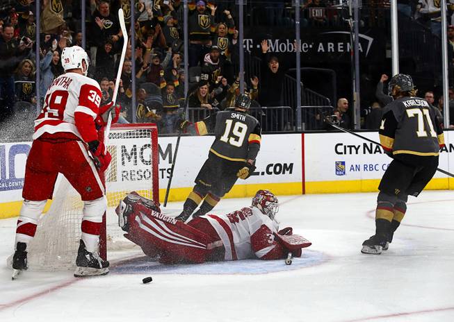 Vegas Golden Knights right wing Reilly Smith (19) scores past Detroit Red Wings goaltender Jimmy Howard (35) during the third period at T-Mobile Arena Saturday, March 23, 2019. Detroit Red Wings right wing Anthony Mantha (39) is at right.