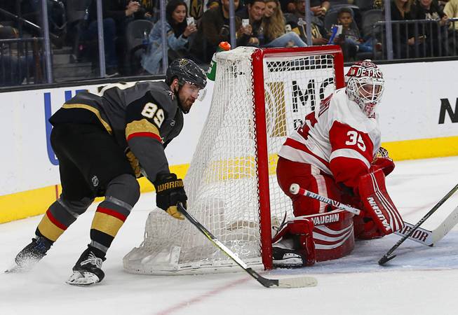 Vegas Golden Knights right wing Alex Tuch (89) attempts a wraparound goal against Detroit Red Wings goaltender Jimmy Howard (35) during the third period at T-Mobile Arena Saturday, March 23, 2019.