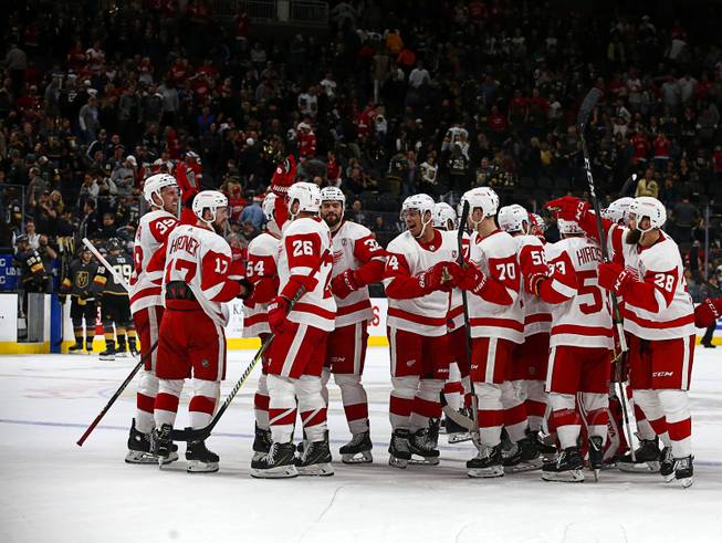 The Detroit Red Wings celebrate their 3-2 overtime win over the Vegas Golden Knights at T-Mobile Arena Saturday, March 23, 2019.