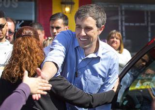 Democratic presidential candidate Beto O'Rourke of Texas reaches out to a supporter during a campaign stop at Arandas Taqueria on North Nellis Boulevard Sunday, March 24, 2019.