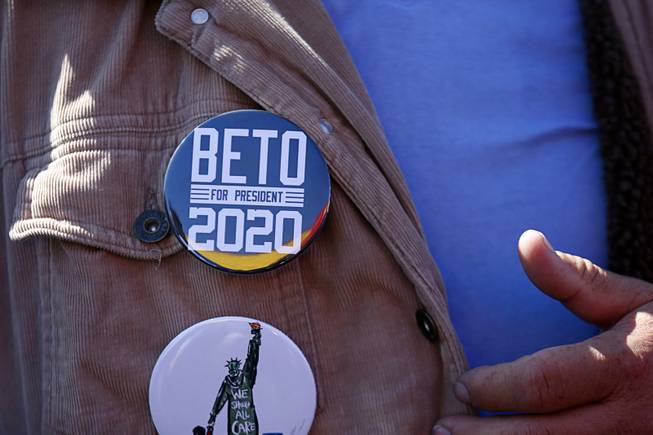 A supporter displays a button for Democratic presidential candidate Beto O'Rourke of Texas at Arandas Taqueria on North Nellis Boulevard Sunday, March 24, 2019.