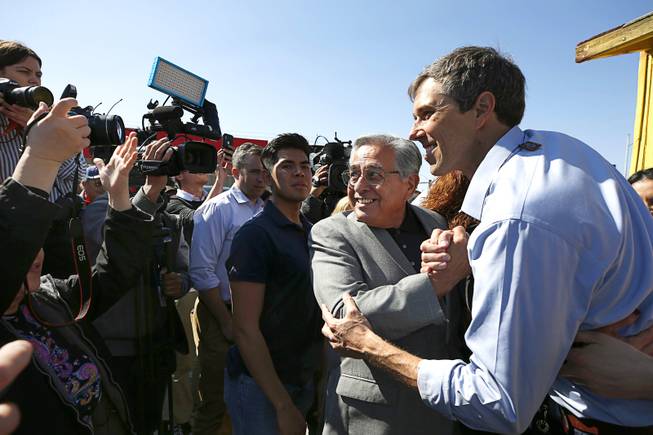 Democratic presidential candidate Beto O'Rourke, right, of Texas poses with Fernando Romero, president of Hispanics in Politics, during a campaign stop at Arandas Taqueria on North Nellis Boulevard Sunday, March 24, 2019.