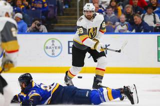 Vegas Golden Knights' Alex Tuch (89) has his pass deflected by St. Louis Blues' Alex Pietrangelo (27) during the first period of an NHL hockey game Monday, March 25, 2019, in St. Louis.