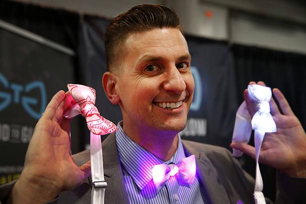 James Barlow, owner of Good To Glow, shows off light-up bowties during the Nightclub & Bar Convention and Trade Show at the Las Vegas Convention Center Tuesday, March 26, 2019.