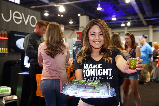 Judith Valles hands out jello shots made with the Jevo jello shot machine during the Nightclub & Bar Convention and Trade Show at the Las Vegas Convention Center Tuesday, March 26, 2019. The Jevo can make a tray of 20 jello shots in just four minutes, she said.