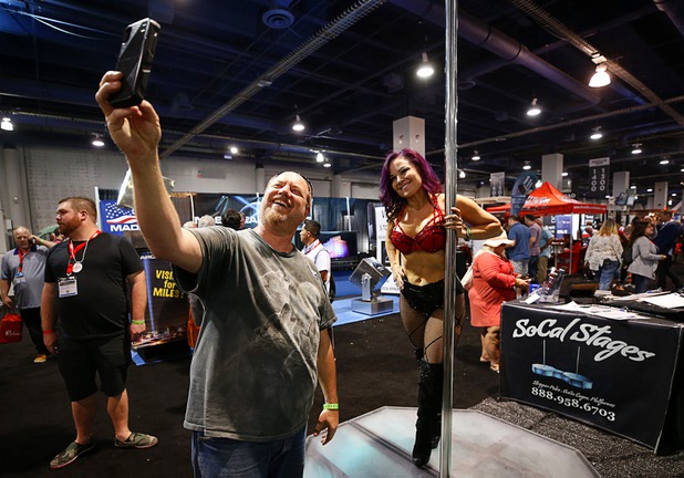 Dave Hendrickson, owner of Kings Cabaret in Dallas, Texas, takes a selfie with Lisa Herr at the SoCal Stages booth during the Nightclub & Bar Convention and Trade Show at the Las Vegas Convention Center Tuesday, March 26, 2019.