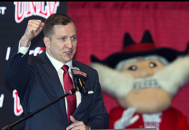 T.J. Otzelberger, UNLV's new men's basketball head coach pumps his fist during a news conference at the Thomas & Mack Center Thursday, March 28, 2019.
