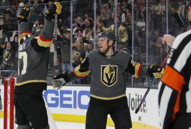 Vegas Golden Knights left wing Max Pacioretty, left, celebrates after center Paul Stastny, right, scored against the Minnesota Wild during the second period of an NHL hockey game Friday, March 29, 2019, in Las Vegas. (AP Photo/John Locher)