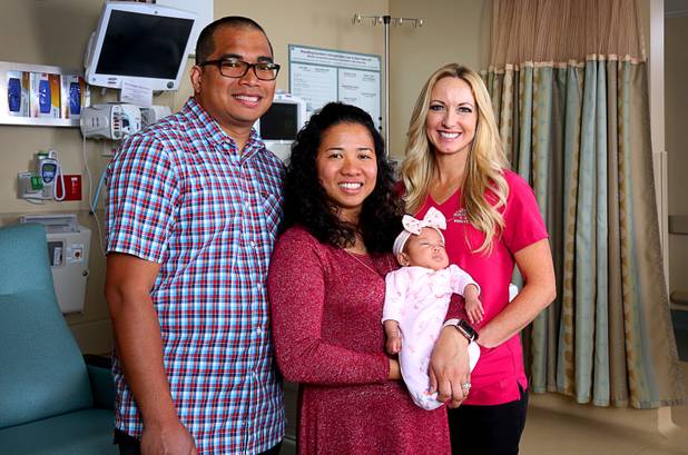 Joel and Rosemarie Andaya pose with their daughter Alita and NICU nurse Johanna Gurr at Mountain View Hospital Tuesday, April 2, 2019. Gurr learned basic sign language to communicate with the parents who are both hearing impaired. Alita was born Jan. 16, 2019. 