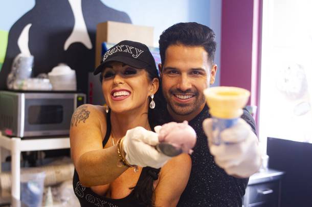 Celebrity scoopers Jennifer Romas from Sexxy, left, and BMXer Ricardo Laguna, right, pose for a photo during Ben & Jerry's Free Cone day at The District at Green Valley Ranch Tuesday, April 9, 2019. All donations benefit the Court Appointed Special Advocate (CASA) Foundationa nonprofit group supporting children in foster care.