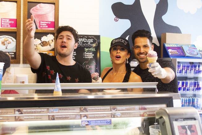 Celebrity scoopers Daniel Emmet, finalist from America's Got Talent season 13, left, Jennifer Romas from Sexxy, center, and BMXer Ricardo Laguna, right, pose for a photo during Ben & Jerry's Free Cone day at The District at Green Valley Ranch Tuesday, April 9, 2019. All donations benefit the Court Appointed Special Advocate (CASA) Foundationa nonprofit group supporting children in foster care.