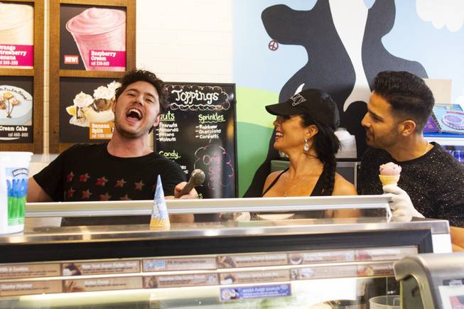 Celebrity scoopers Jennifer Romas from Sexxy, center, and BMXer Ricardo Laguna, right, look on as America's Got Talent season 13 finalist Daniel Emmet sings during Ben & Jerry's Free Cone day at The District at Green Valley Ranch Tuesday, April 9, 2019. All donations benefit the Court Appointed Special Advocate (CASA) Foundationa nonprofit group supporting children in foster care.