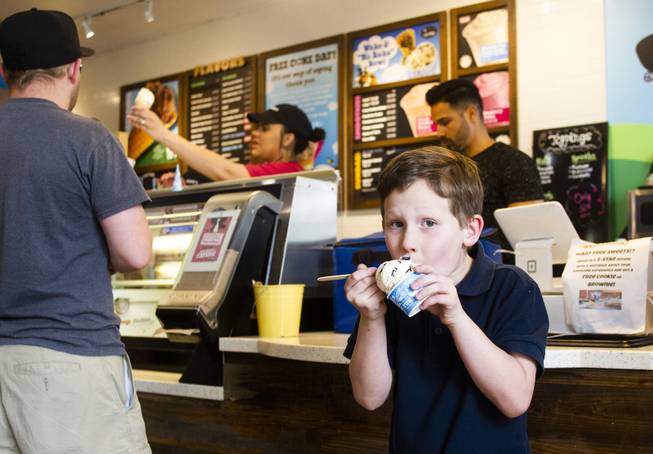 Cannon Sarazin, 7, takes a bite of ice cream after getting his free scoop during Ben & Jerry's Free Cone day at The District at Green Valley Ranch Tuesday, April 9, 2019. All donations benefit the Court Appointed Special Advocate (CASA) Foundationa nonprofit group supporting children in foster care.