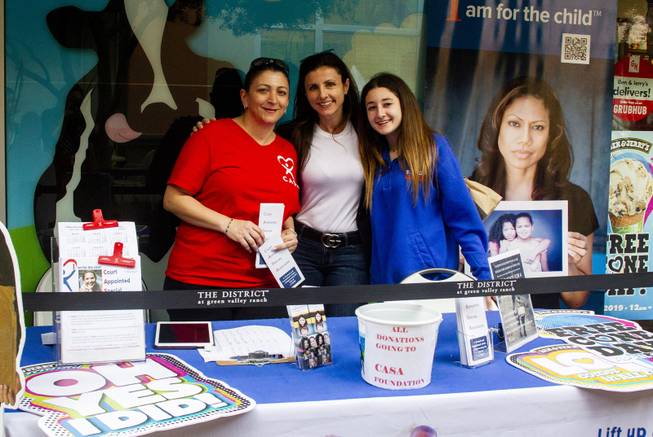 CASA President Elizabeth Ham, center, poses for a photos with her daughter Isabel Ham, right, and volunteer Mimi Merhi, left, during Ben & Jerry's Free Cone day at The District at Green Valley Ranch Tuesday, April 9, 2019. All donations benefit the Court Appointed Special Advocate (CASA) Foundationa nonprofit group supporting children in foster care.