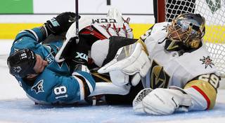 Vegas Golden Knights goalie Marc-Andre Fleury, right, and San Jose Sharks' Micheal Haley (18) tangle during the third period of Game 1 of an NHL hockey first-round playoff series Wednesday, April 10, 2019, in San Jose, Calif.