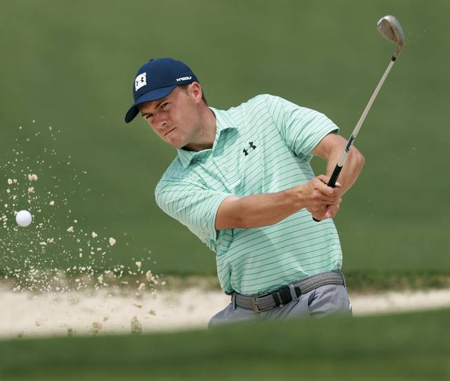 Jordan Spieth hits from the bunker to the second green during his practice round for the Masters at Augusta National Golf Club on Tuesday, April 9, 2019, in Augusta, Ga.