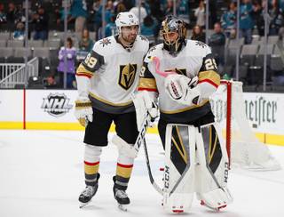Vegas Golden Knights' Alex Tuch, left, celebrates with goaltender Marc-Andre Fleury (29) after the team's 5-3 win against the San Jose Sharks during Game 2 of an NHL hockey first-round playoff series Friday, April 12, 2019, in San Jose, Calif.