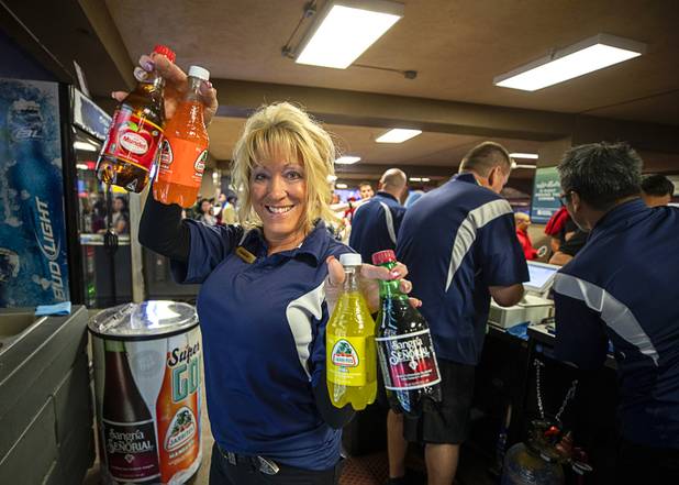 Bartender Theresa McWilliams poses with Jarritos soda and other Mexican soft drinks before a game between the Las Vegas Lights FC and the Tacoma Defiance at Cashman Field Saturday, April 13, 2019. The Lights shut out the Defiance 5-0.