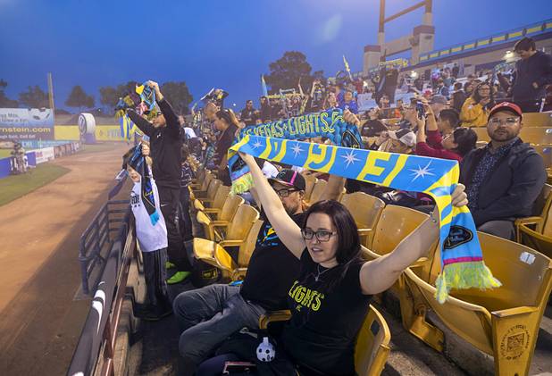 Fans hold up their Las Vegas Lights FC scarves during a game against the Tacoma Defiance at Cashman Field Saturday, April 13, 2019. The Lights shut out the Defiance 5-0.