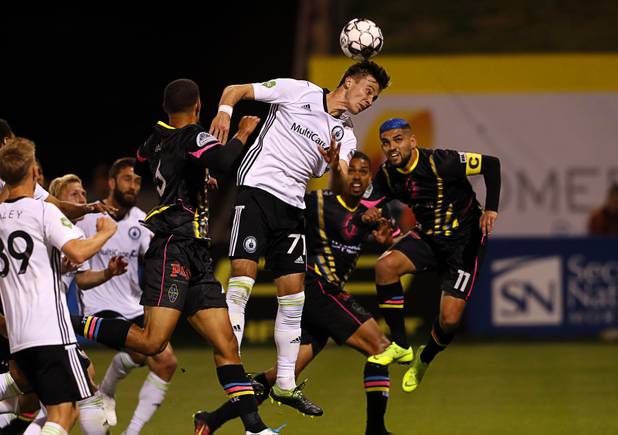 Tacoma Defiance's Aleks Berkolds (71) head the ball away from Las Vegas Lights players during a game at Cashman Field Saturday, April 13, 2019. The Lights shut out the Defiance 5-0.