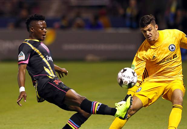 Las Vegas Lights' Tabort Etaka Preston (19) takes a shot on goal against Tacoma Defiance goaltender Trey Muse (1) at Cashman Field Saturday, April 13, 2019. The Lights shut out the Defiance 5-0.