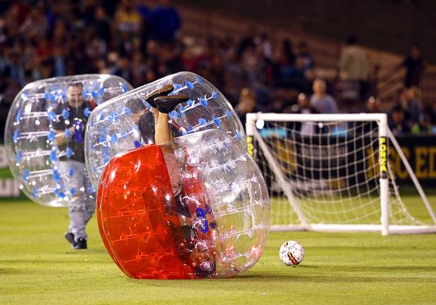 A bubble soccer player is upended in a halftime game as the Las Vegas Lights FC play the Tacoma Defiance at Cashman Field Saturday, April 13, 2019. The Lights shut out the Defiance 5-0.