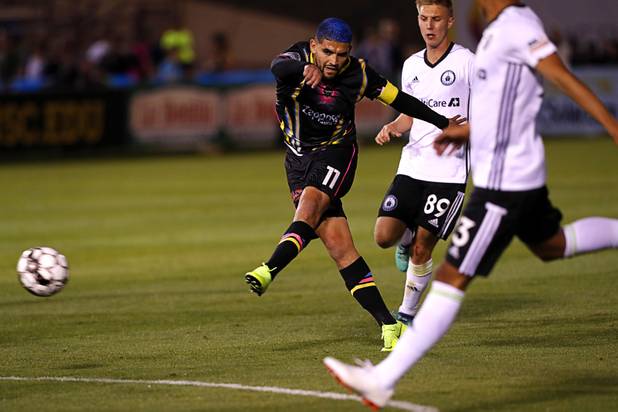 Las Vegas Lights' Irvin Parra (11) takes a shot on goal during a game against the Tacoma Defiance at Cashman Field Saturday, April 13, 2019. The Lights shut out the Defiance 5-0.