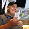 James Adducci holds up his winning ticket after winning more than $1 million betting on Tiger Woods winning the Masters, Monday, April 15, 2019, in Las Vegas. 