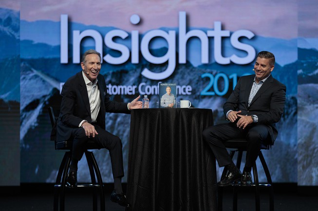 Former Starbucks CEO Howard Schultz laughs on stage with Epicor ...