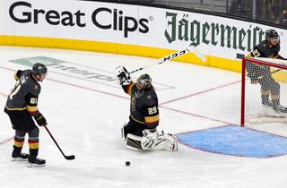 Vegas Golden Knights goaltender Marc-Andre Fleury (29) reacts after being scored on by San Jose Sharks center Tomas Hertl (not pictured) in double overtime during Game 6 of an NHL hockey first-round playoff series at T-Mobile Arena Sunday, April 21, 2019. On the ice with Fleury are Mark Stone, left, and Shea Theodore.