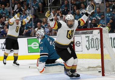 Vegas Golden Knights center Cody Eakin, foreground, celebrates after scoring a goal in front of San Jose Sharks goaltender Martin Jones, center, during the second period of Game 7 of an NHL hockey first-round playoff series in San Jose, Calif., Tuesday, April 23, 2019. 