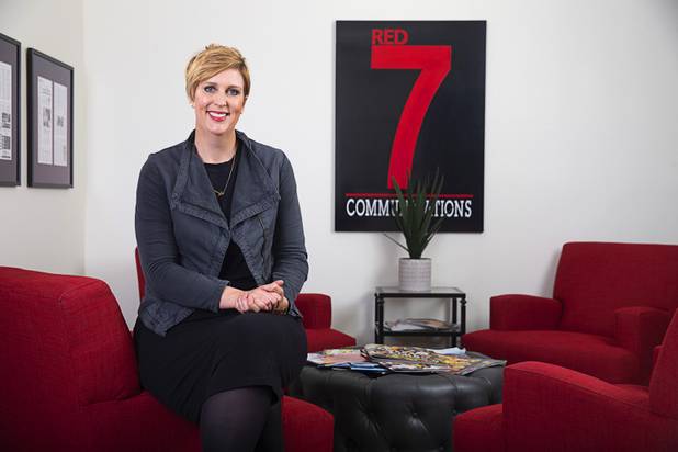 Kathy Topp, president and owner of Red 7 Communications, poses in the lobby of the company's offices Tuesday, April 30, 2019. 