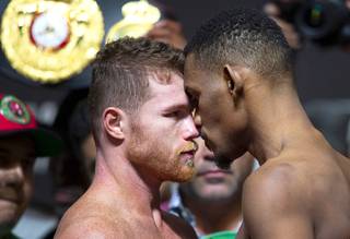 WBC/WBA middleweight champion Canelo Alvarez, left, and IBF middleweight champion Daniel Jacobs face off during their official weigh-in at T-Mobile Arena on May 3, 2019 in Las Vegas, Nevada. Alvarez and Jacobs will meet in a middleweight unification fight Saturday at T-Mobile Arena.