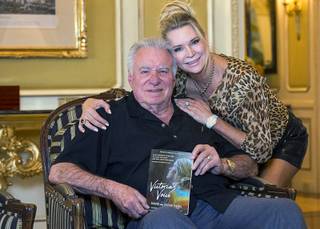 Westgate Las Vegas CEO David Siegel and wife Jackie appear Friday, May 3, 2019, with the book 