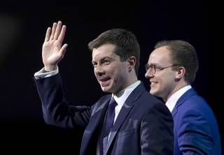 Democratic presidential candidate Pete Buttigieg, left, is joined onstage by his husband Chasten Glezman after speaking during the Human Rights Campaign's 14th Annual Las Vegas Gala at Caesars Palace in Las Vegas Saturday, May 11, 2019.