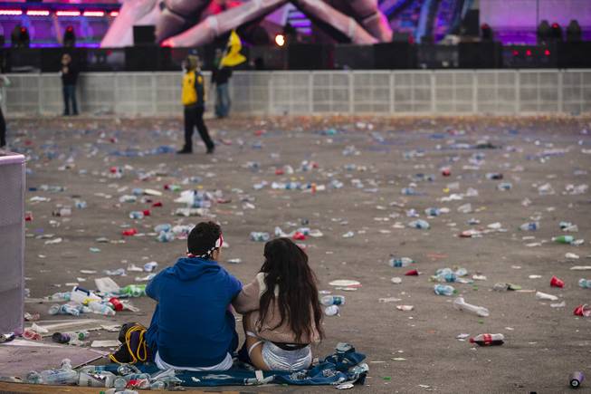Festival-goers sit together at the closing of the Electric Daisy Carnival at the Las Vegas Motor Speedway Monday, May 20, 2019.