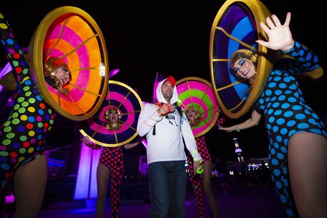Performers surround a festival-goer during night three of the Electric Daisy Carnival at the Las Vegas Motor Speedway Monday, May 20, 2019.