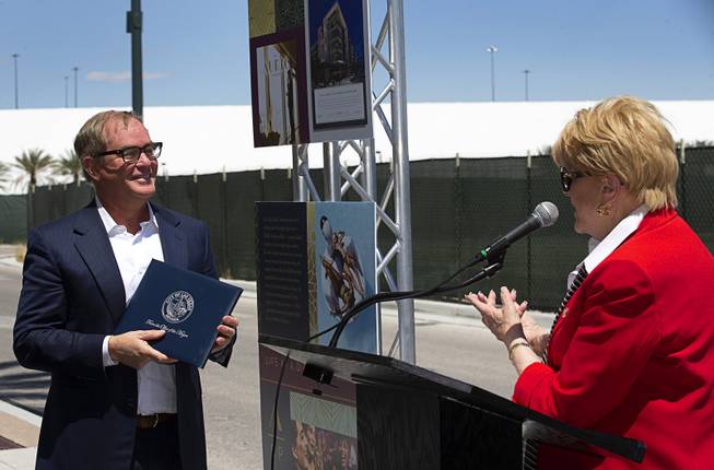 Las Vegas Mayor Carolyn Goodman presents an official proclamation to Tim Downey, CEO, Southern Land Company (SLC), during a groundbreaking ceremony for Auric, a luxury, mid-rise apartment complex, at Symphony Park in downtown Las Vegas, May 21, 2019. The complex will be built on six acres of vacant land north of the Smith Center for the Performing Arts.