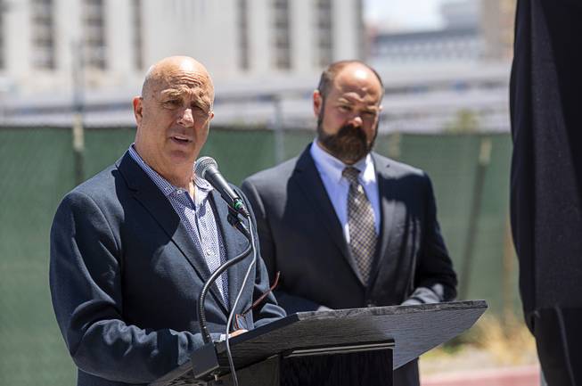 Marc Abelman, a board member with the Downtown Vegas Alliance and the 18b The Las Vegas Arts District, during a groundbreaking ceremony for Auric, a luxury, mid-rise apartment complex by Southern Land Company (SLC), at Symphony Park in downtown Las Vegas, May 21, 2019. Kevin House, vice president of multifamily development for SLC, listens at right.