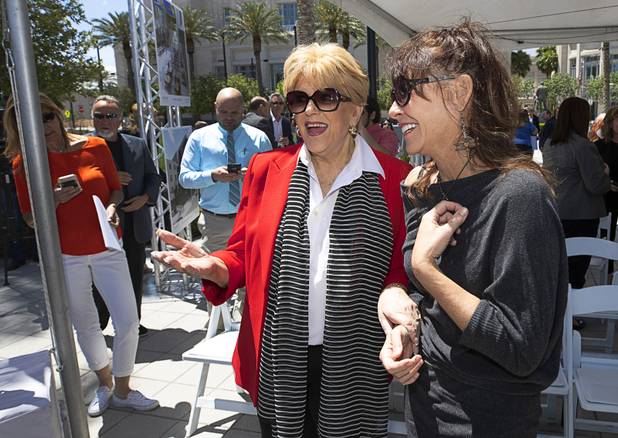 Las Vegas Mayor Carolyn Goodman, left, talks with artist Niki Sands after Sands' artwork was unveiled during a groundbreaking ceremony for Auric, a luxury, mid-rise apartment complex by Southern Land Company (SLC), at Symphony Park in downtown Las Vegas, May 21, 2019. The complex will be built on six acres of vacant land north of the Smith Center for the Performing Arts.