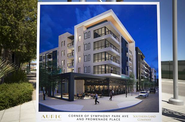 An artist's illustration showing a street view of Auric is displayed during a groundbreaking ceremony for the luxury, mid-rise apartment complex by Southern Land Company (SLC), at Symphony Park in downtown Las Vegas, May 21, 2019. The complex will be built on six acres of vacant land north of the Smith Center for the Performing Arts.