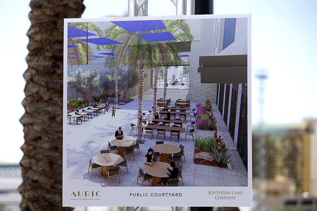 An artist's illustration showing Auric's public courtyard  is displayed during a groundbreaking ceremony for the luxury, mid-rise apartment complex by Southern Land Company (SLC), at Symphony Park in downtown Las Vegas, May 21, 2019. The complex will be built on six acres of vacant land north of the Smith Center for the Performing Arts.