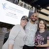 Kelly Trolia, left, and Jet Mitchell stand with Golden Knight Pierre-Edouard Bellemare in this file photo. The women, who are cancer survivors, helped shave Bellemare’s head to kick off Breast Cancer Awareness Month in October.