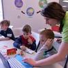 Co-owner Elise Silva shows students how to code at Engineering For Kids.